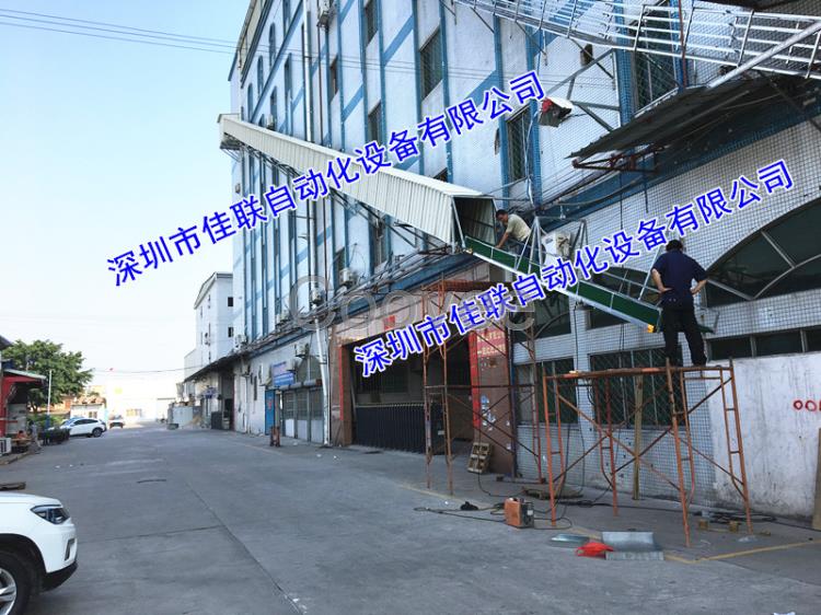 墻外一樓到三樓四樓斜坡運貨伸縮傳送帶